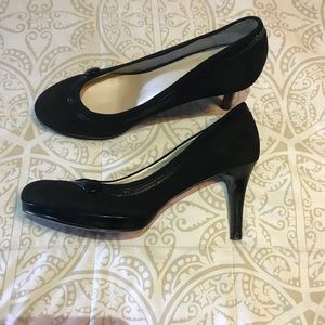Black Nine West pumps with button detail